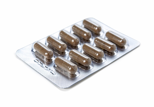 Herbal drug panels pack in capsules on a white background.