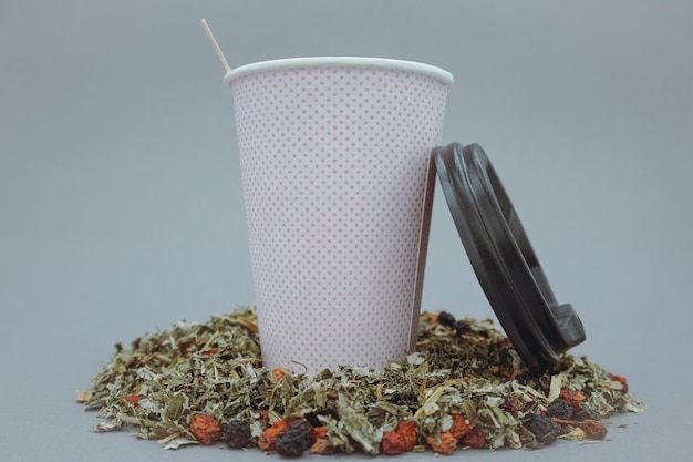 Herbal green tea and pink paper cup.