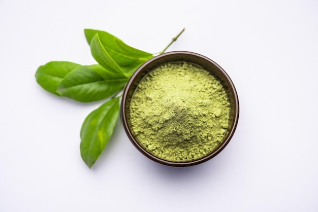 Herbal henna or Mehandi powder in a bowl forming heap, Used for Tattoo or Hair Dye in India