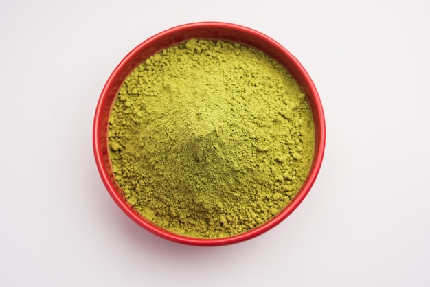 Herbal henna or Mehandi powder in a bowl forming heap, Used for Tattoo or Hair Dye 