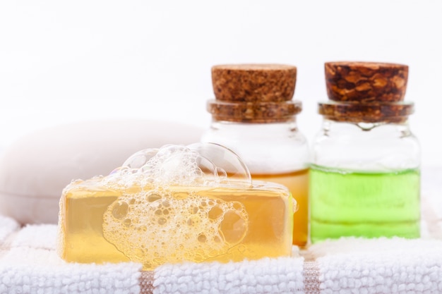 Herbal spa soap on white bath towel with honey isolate on white background.