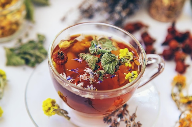 Herbal tea with medicinal herbs and flowers Selective focus