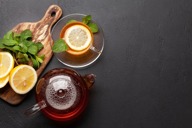 Herbal tea with mint and lemon Tea cup and teapot