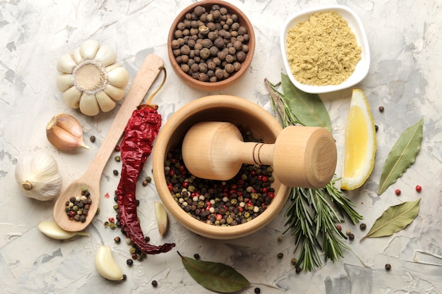 Herbs and spices. various seasonings, herbs and spices on a light concrete background. top view