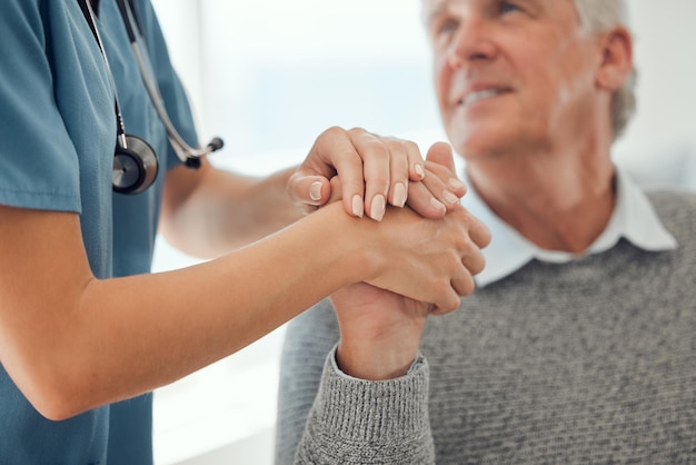 Here for you Cropped shot of an unrecognizable doctor offering their patient support in a hard time