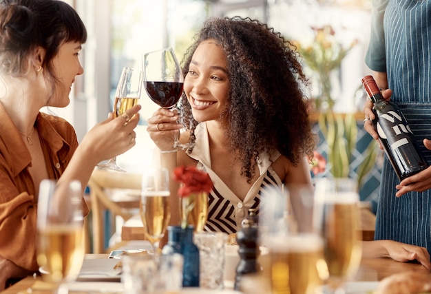 Heres to you my darling. Shot of two friends toasting with red wine in a restaurant.