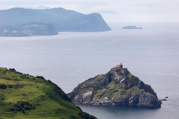 Hermitage on top of Gaztelugatxe island is accessed by narrow path Biscay Basque Country