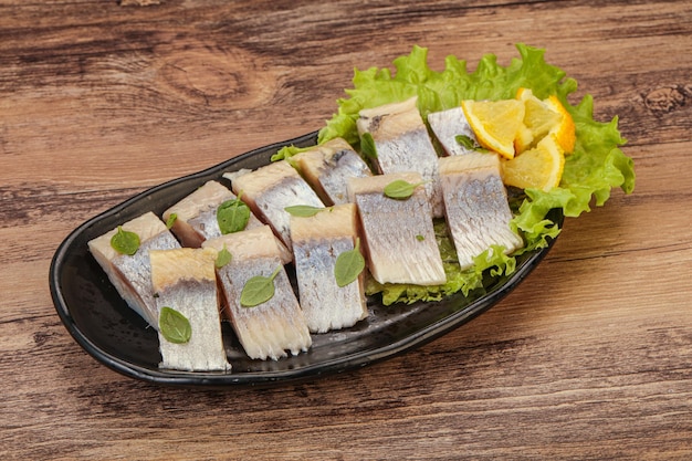 Herring fillet with sliced lemon