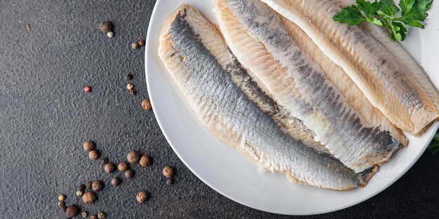 Herring fish fillet fresh seafood meal snack on the table copy space food