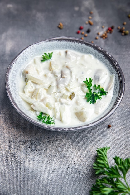 herring sour cream white sauce fresh healthy meal food snack on the table copy space food