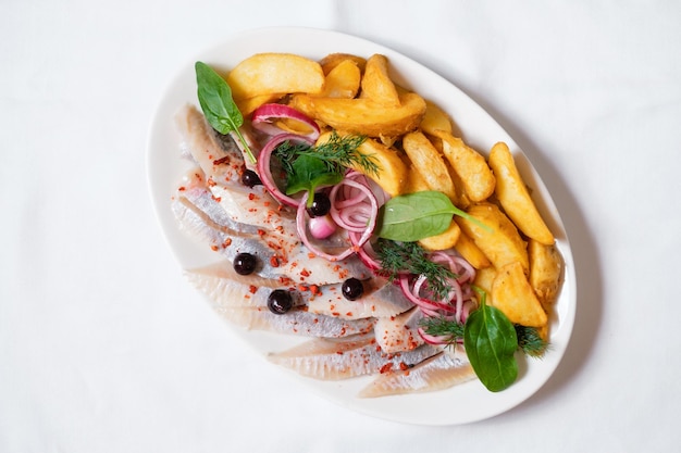 Herring with baked potatoes and onions