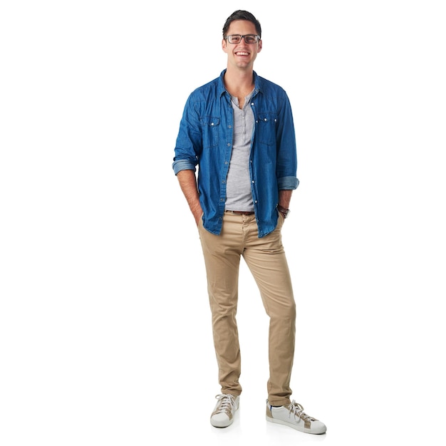 Hes cool and casual Studio portrait of a handsome young man standing with his hands in his pockets isolated on white