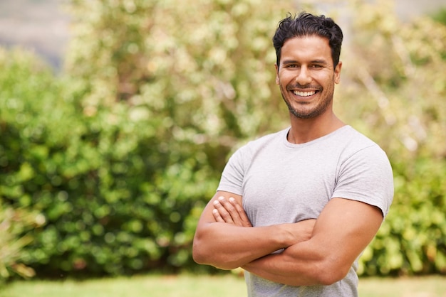 Hes got such a charming smile Portrait of a handsome man standing outside