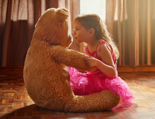 Hes my closest friend Shot of a little girl playing with her teddy bear