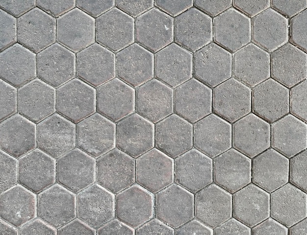 Photo hexagon outdoor paving stone tiles paving cobble stone in grey natural stone color