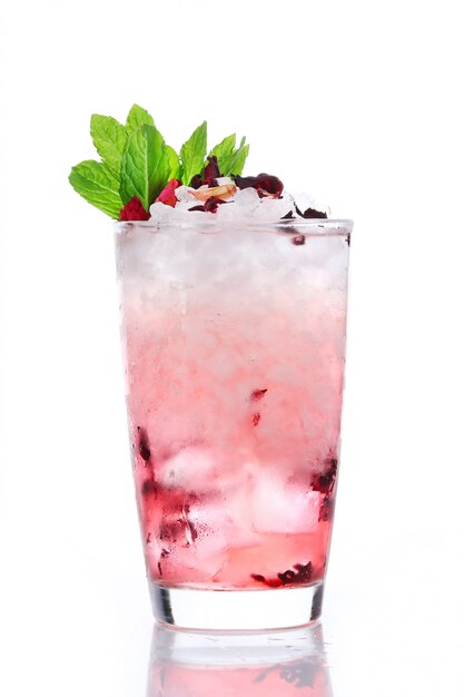 Hibiscus lemonade with berries and ice. Cocktail isolated on white