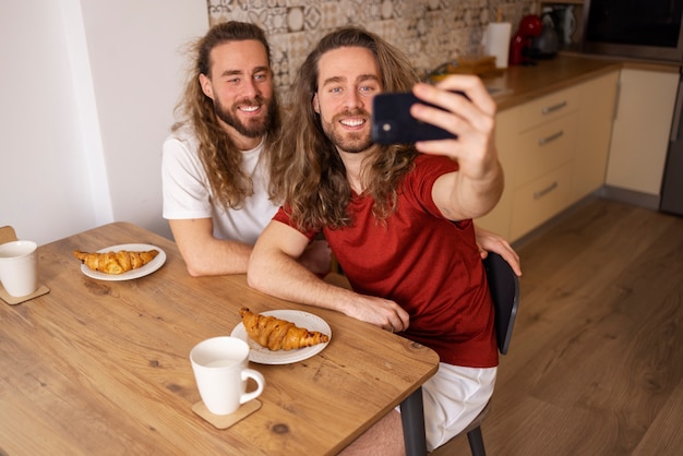 High angle brothers taking selfie