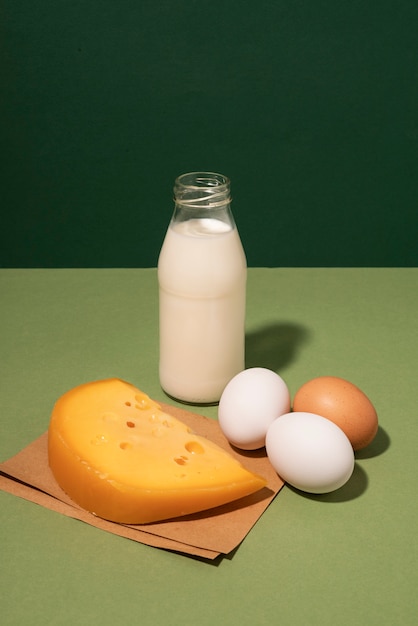 High angle cheese, eggs and milk arrangement