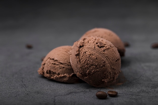 High angle chocolate ice cream scoops on table