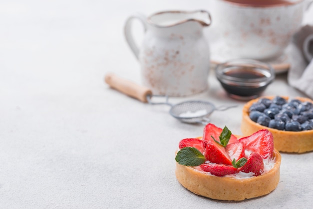 High angle of fruit tarts with copy space