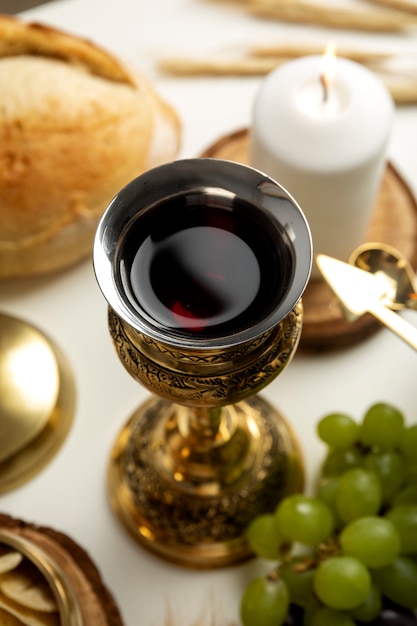 High angle holy communion with chalice and grapes