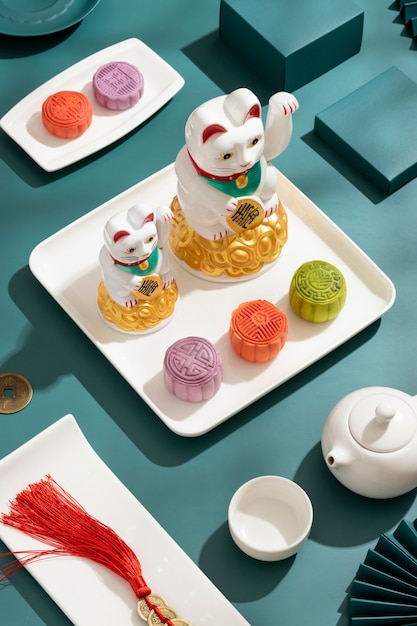 High angle lucky cats on white plate