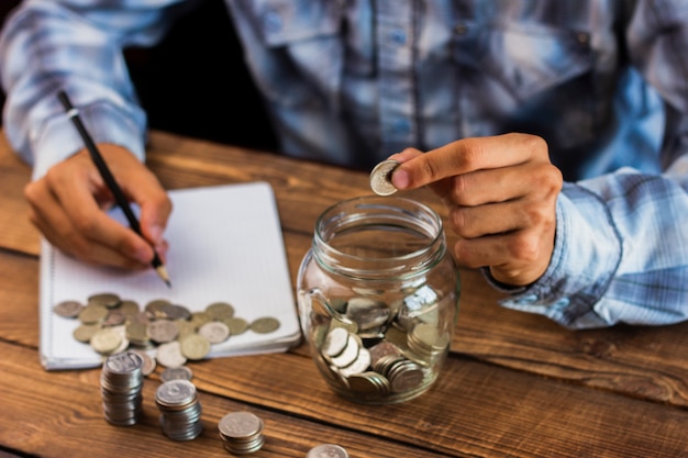 High angle man calculating savings