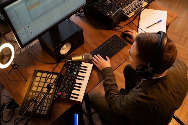 High angle musician working in studio