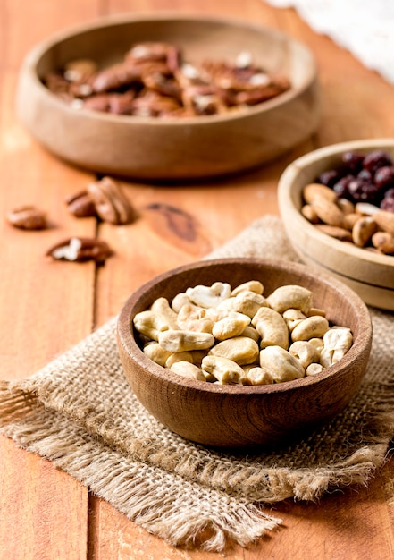 High angle of peanuts and walnuts in bowls