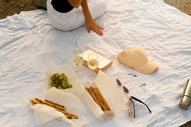 High angle picnic with snacks and wine