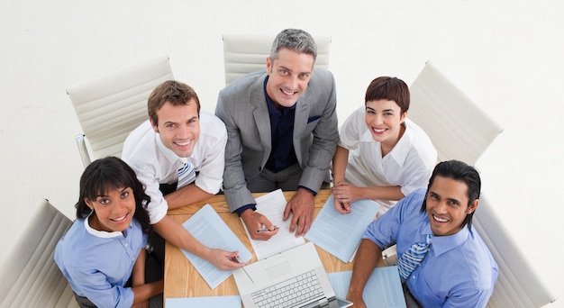 High angle of a positive business team studying a document 