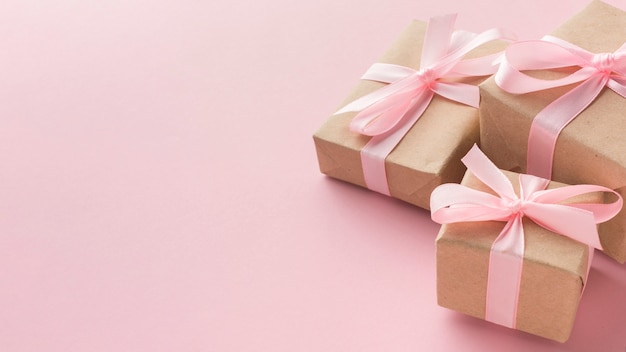 High angle of presents with pink ribbon