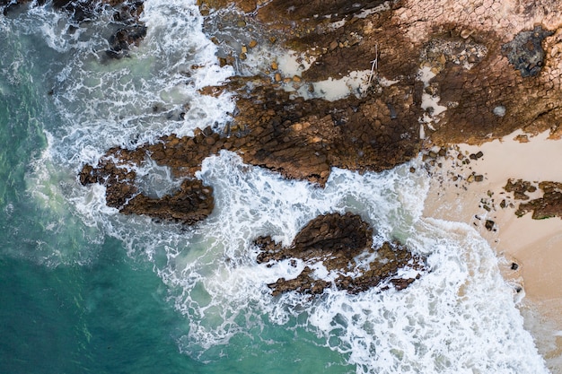 High angle shot of coast with rock formations by the sea in Hong Kong