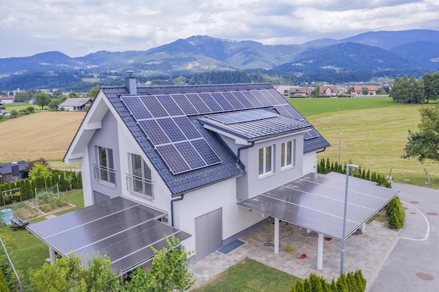 High angle shot of a private house situated in a valley with solar panels on the roof