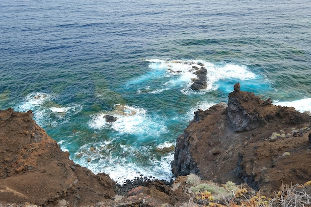 High angle shot of the rocky coast of El Hierro and the blue Atlantic Ocean