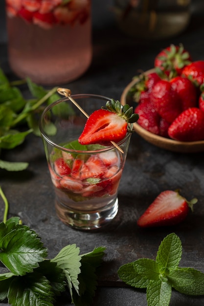 High angle strawberry infused water in glass