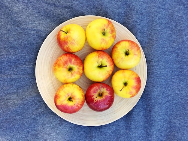 High angle view of apples in plate on table