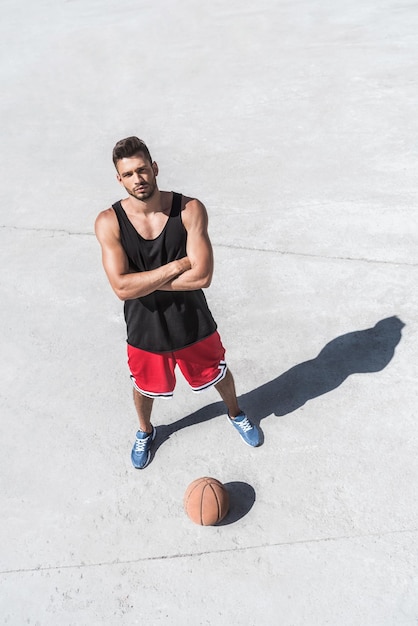 High angle view of athletic basketball player standing on court