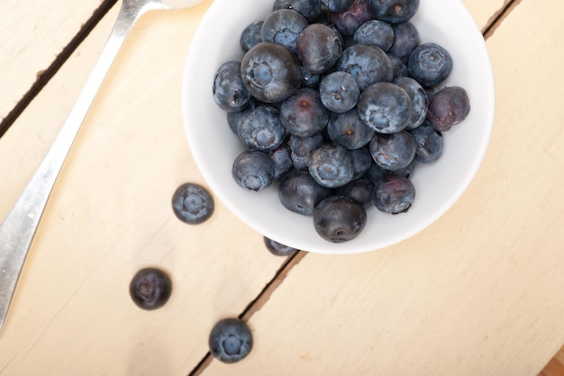 High angle view of blueberries on wooden table