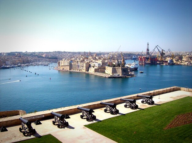 High angle view of cannons by sea at grand harbor