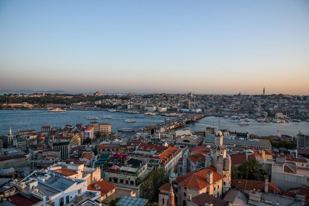 High angle view of city buildings against clear sky