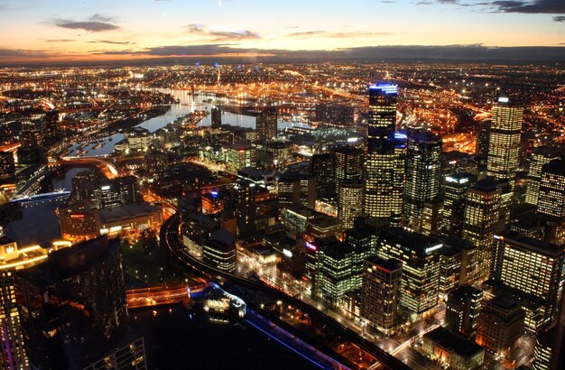 High angle view of city lit up at night