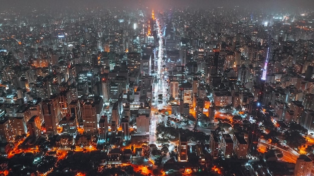 High angle view of city lit up at night