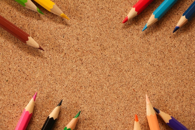 High angle view of colored pencils on sand