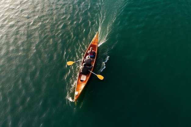 High angle view of couple canoeing in sea