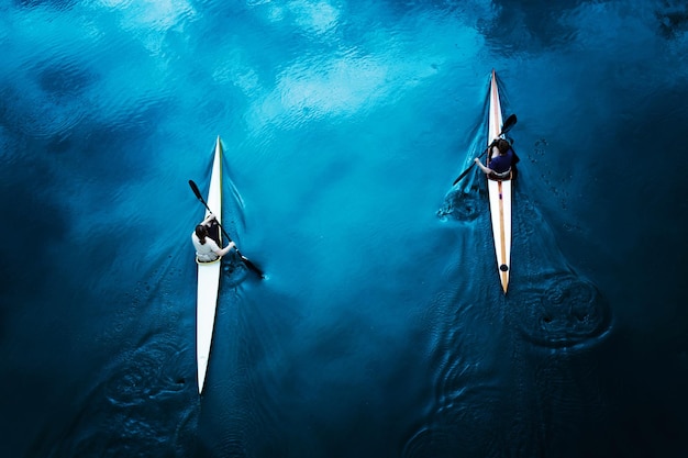 High angle view of couple kayaking on sea