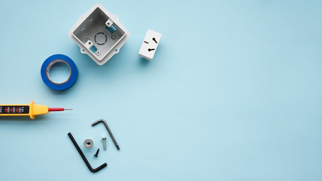 High angle view of electric equipment over blue backdrop