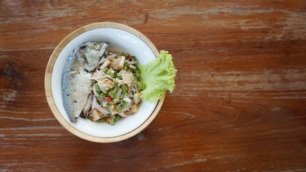 High angle view of food in bowl on wooden table