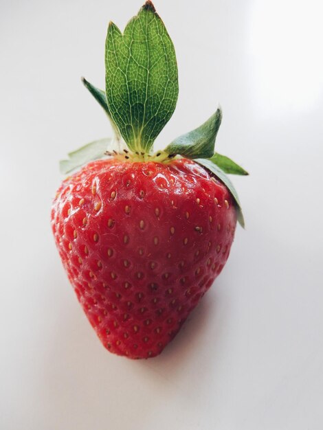 High angle view of fresh red strawberry on white background