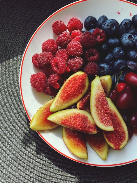 High angle view of fruits in plate on table